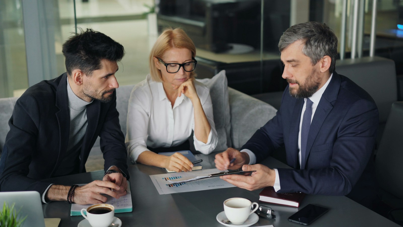 ESG and Sustainability Advisory for Real Estate | Land Sterling | Land Sterling Professionals in an investment review meeting around a table