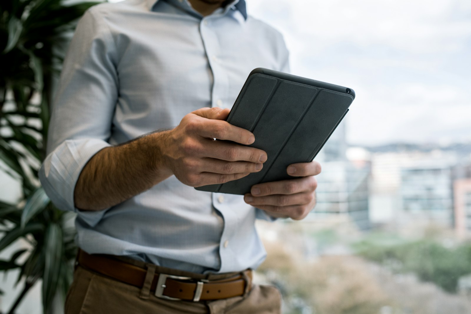 Real Estate ESG | Land Sterling Asset manager reviewing a building scorecard on a tablet