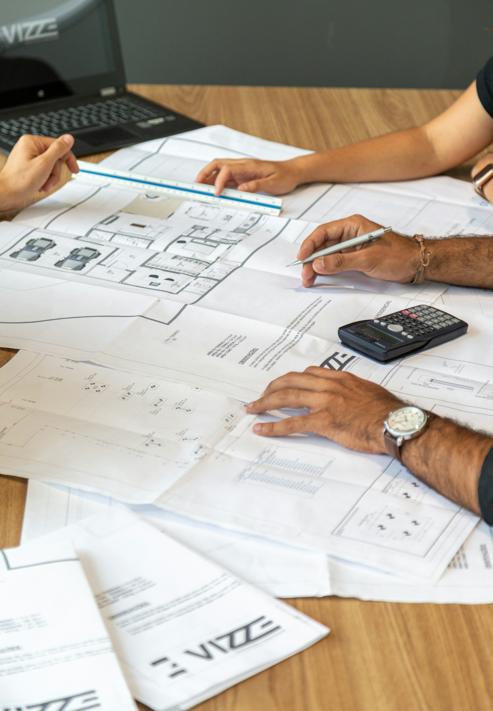 Sustainable Finance and ESG Due Diligence | Land Sterling Consultants reviewing cost estimates and plans